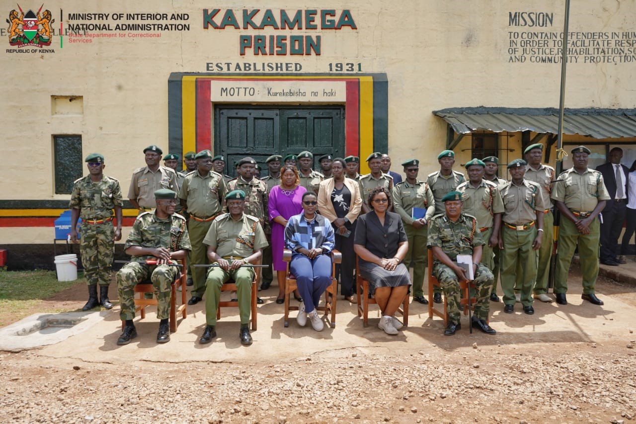 Correctional Services PS Ms. Salome M. Beacco (seated in the middle) takes a group photo during her visit to Kakamega Prison. Photo, Patrick Ambani.